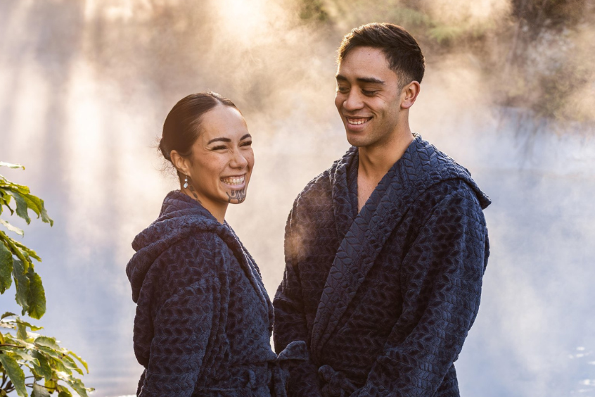 Wairakei-terraces-geothermal-hotpools-couple-simling-maori-culture-3-make-welcome-ca